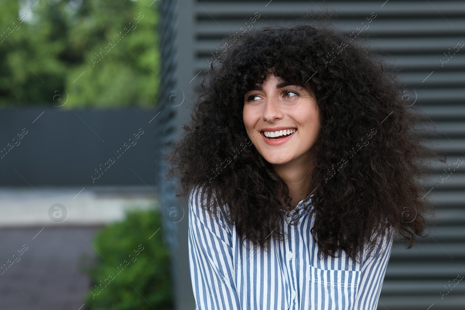 Photo of Portrait of beautiful woman outdoors. Attractive lady smiling and posing for camera. Space for text