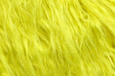 Photo of Texture of yellow faux fur as background, closeup