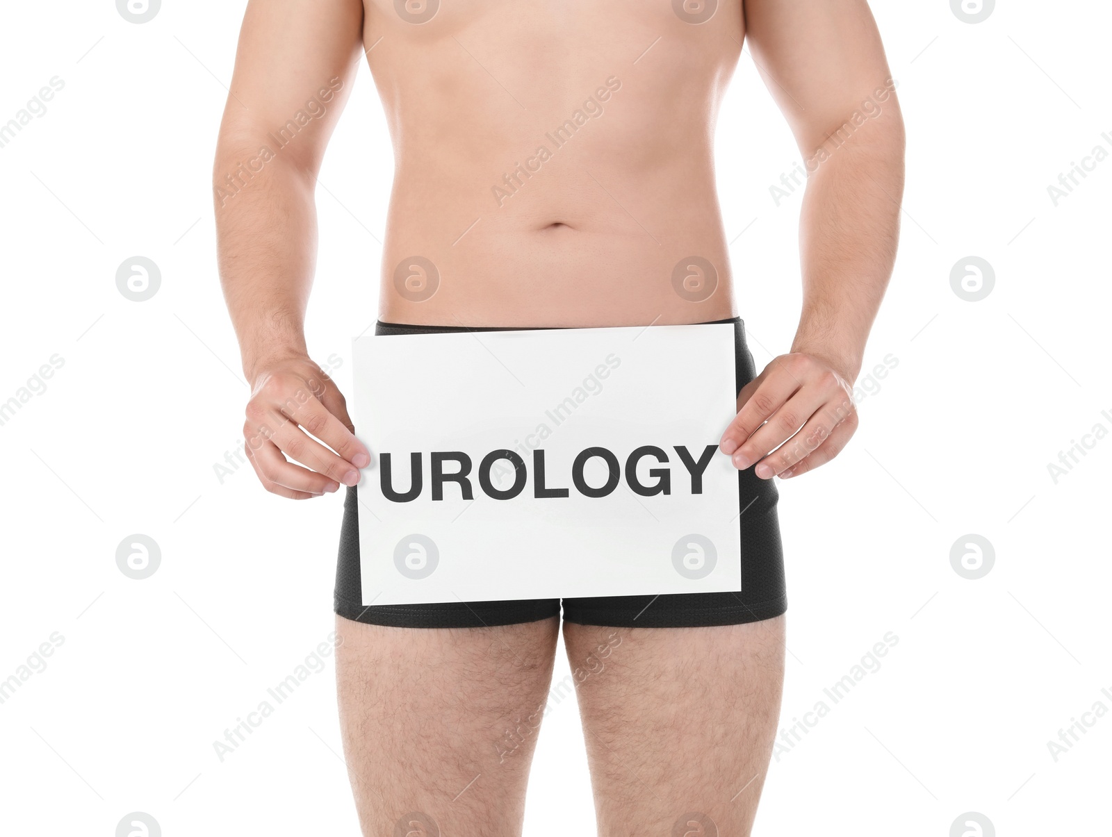 Photo of Young man holding paper with word UROLOGY on white background