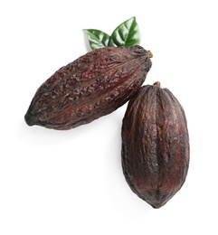 Photo of Cocoa pods and leaves on white background, top view