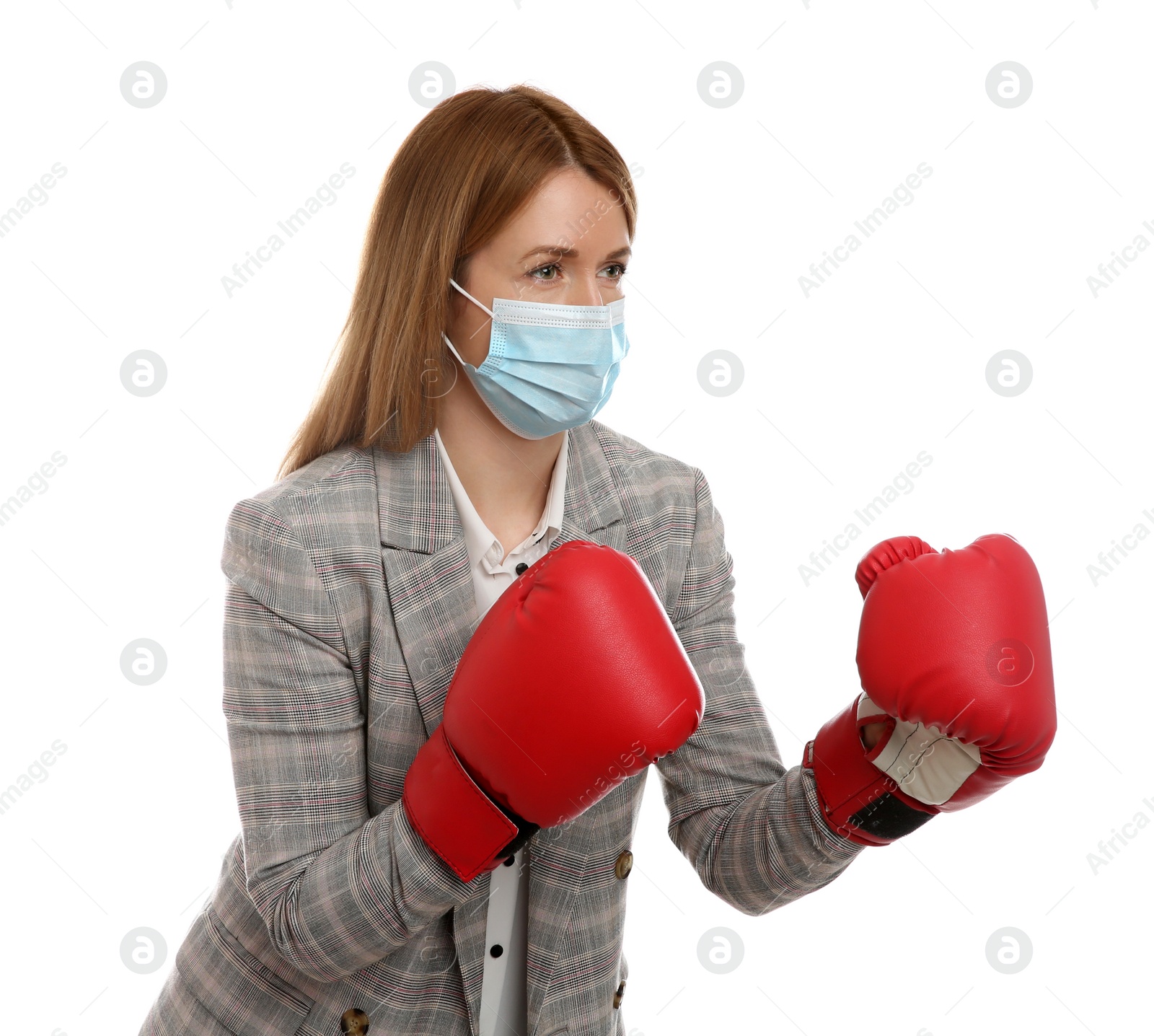 Photo of Businesswoman with protective mask and boxing gloves on white background. Strong immunity concept