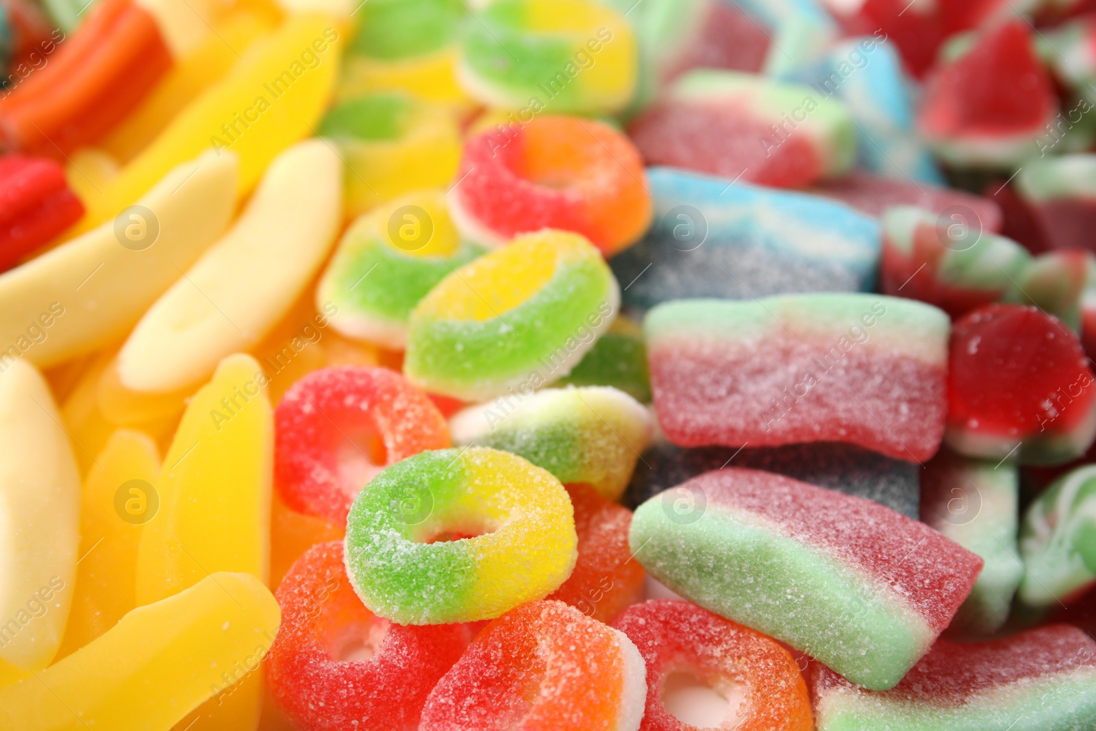 Photo of Tasty colorful jelly candies as background, closeup view