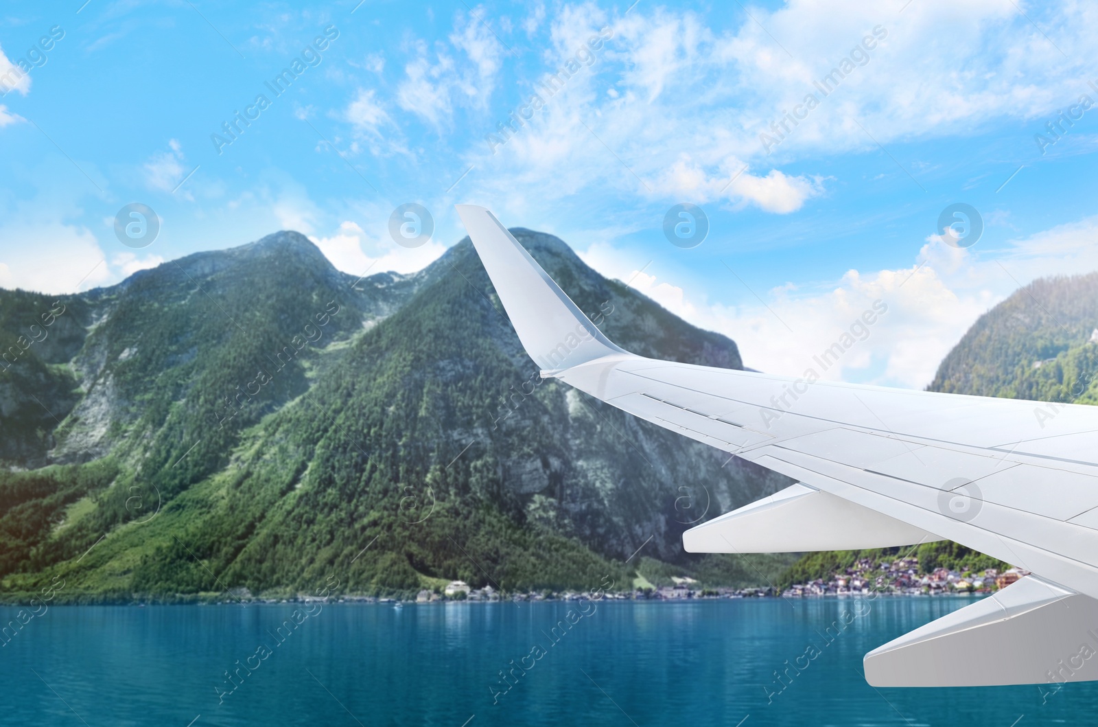 Image of Airplane landing on tropical island, view from porthole