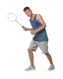 Young man playing badminton with racket on white background