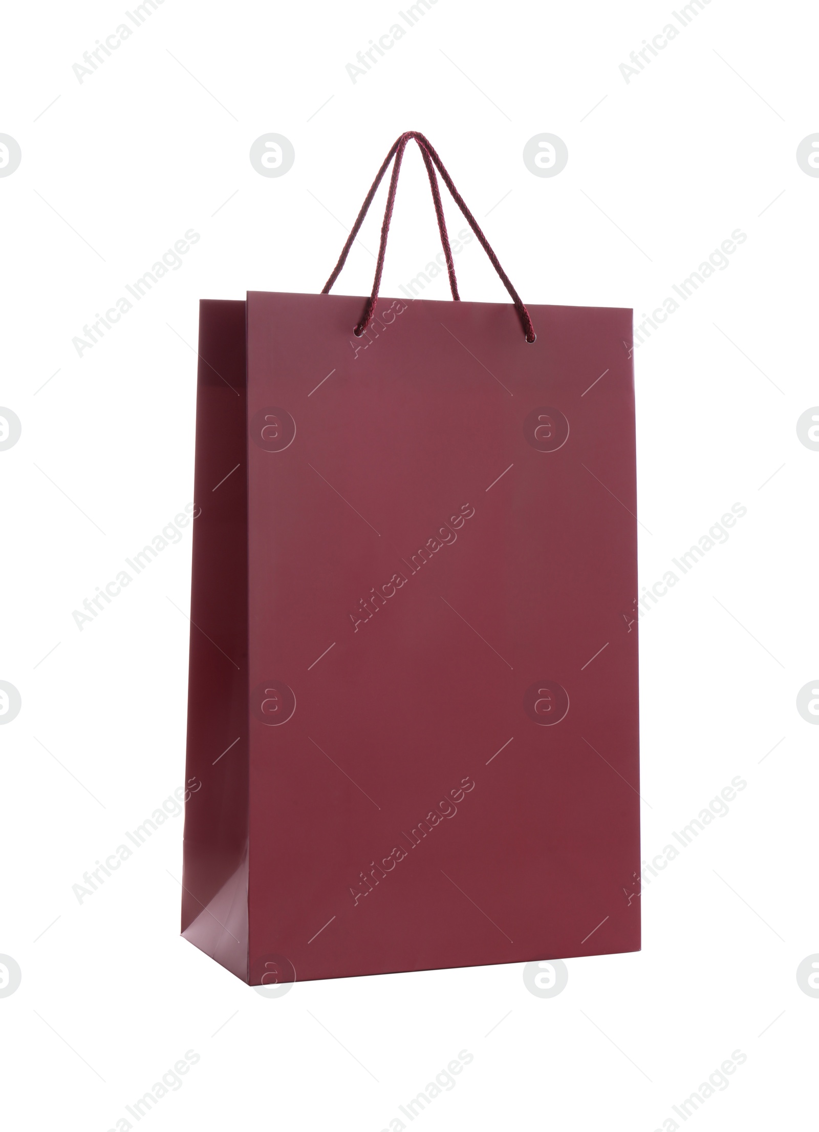 Photo of Burgundy paper shopping bag isolated on white