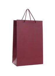 Photo of Burgundy paper shopping bag isolated on white