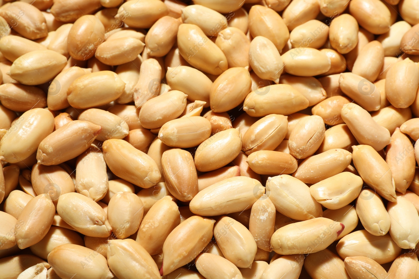 Photo of Fresh peeled peanuts as background, above view