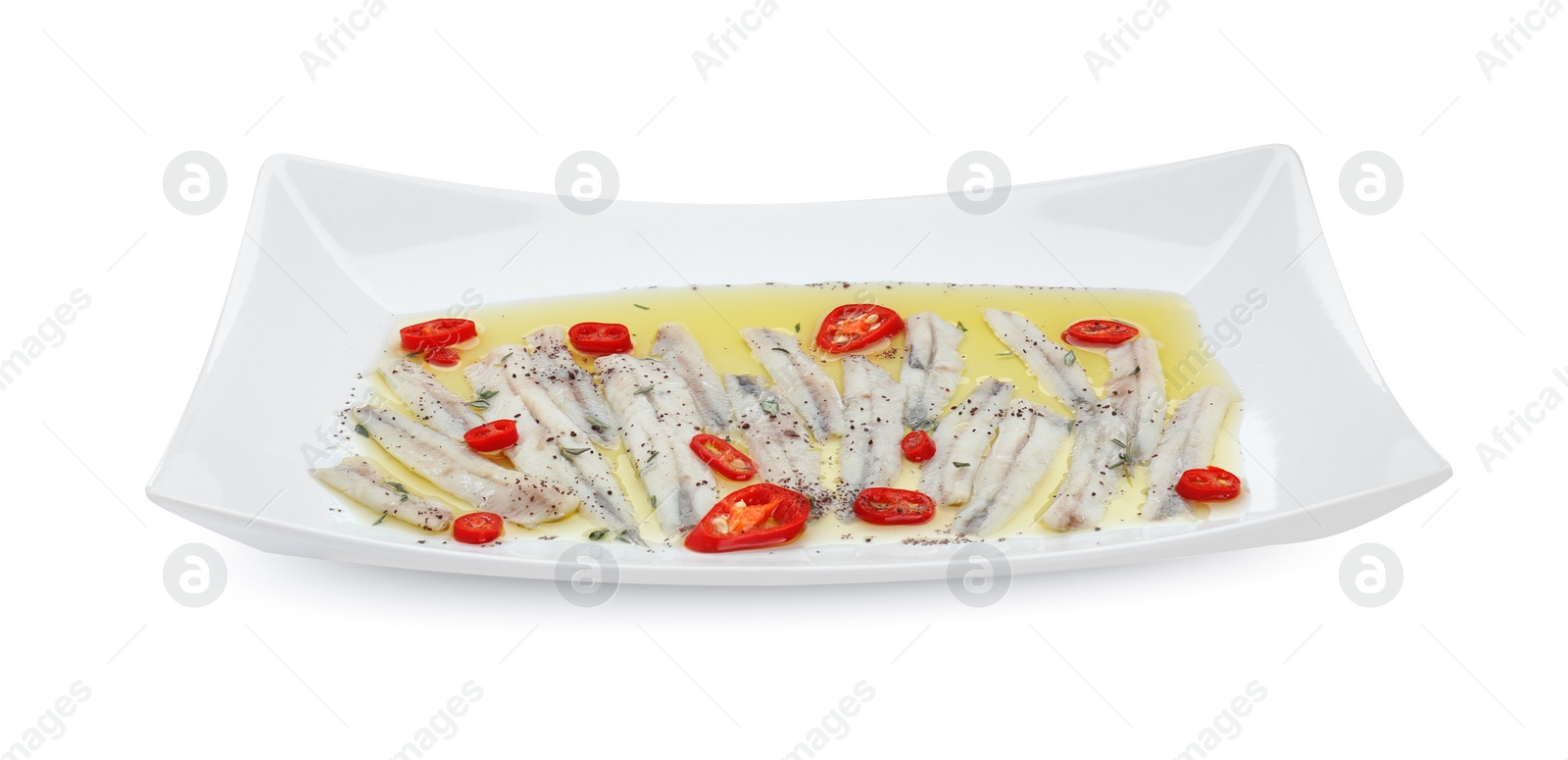 Photo of Tasty pickled anchovies with spices isolated on white