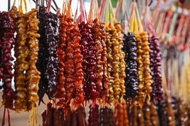 Bunches of different delicious churchkhelas at market