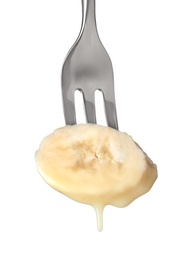 Banana with chocolate on fondue fork against white background