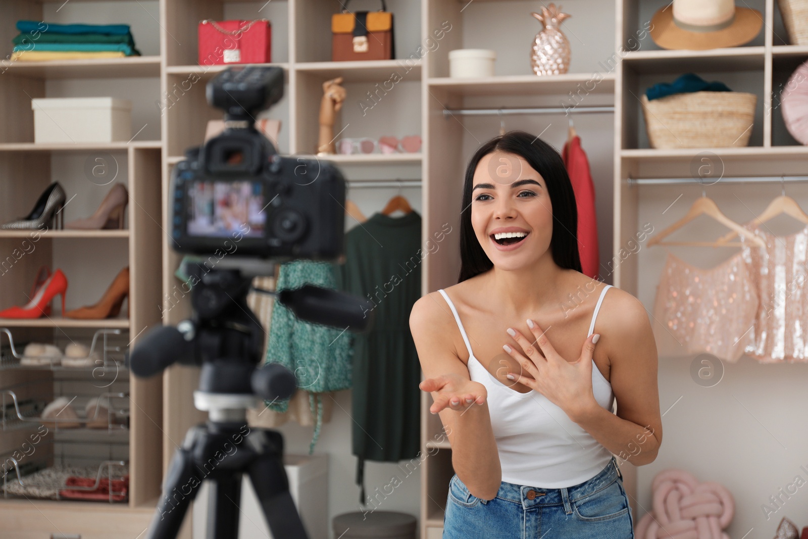 Photo of Emotional fashion blogger recording new video in room