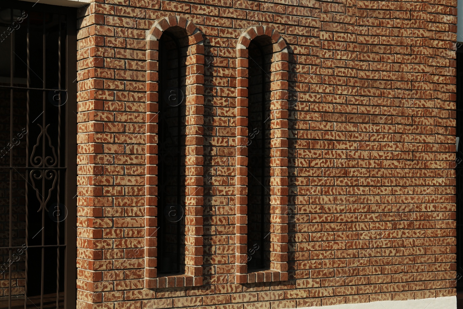 Photo of Beautiful old vintage windows on brick wall