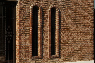 Photo of Beautiful old vintage windows on brick wall