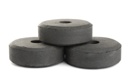 Photo of Charcoal rings for hookah on white background