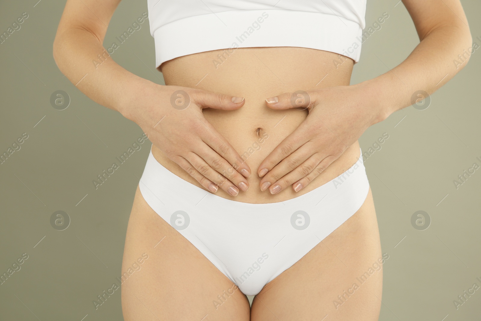 Photo of Gynecology. Woman in underwear on grey background, closeup