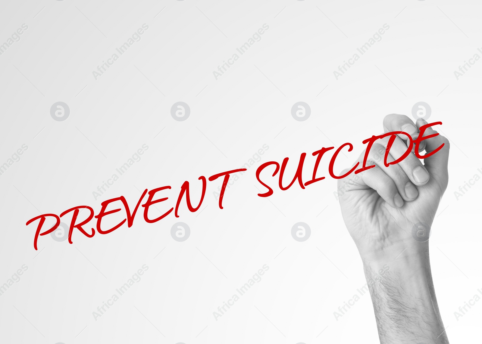 Image of Man writing phrase Prevent Suicide on glass board against white background, closeup. Black and white photo with red color accent