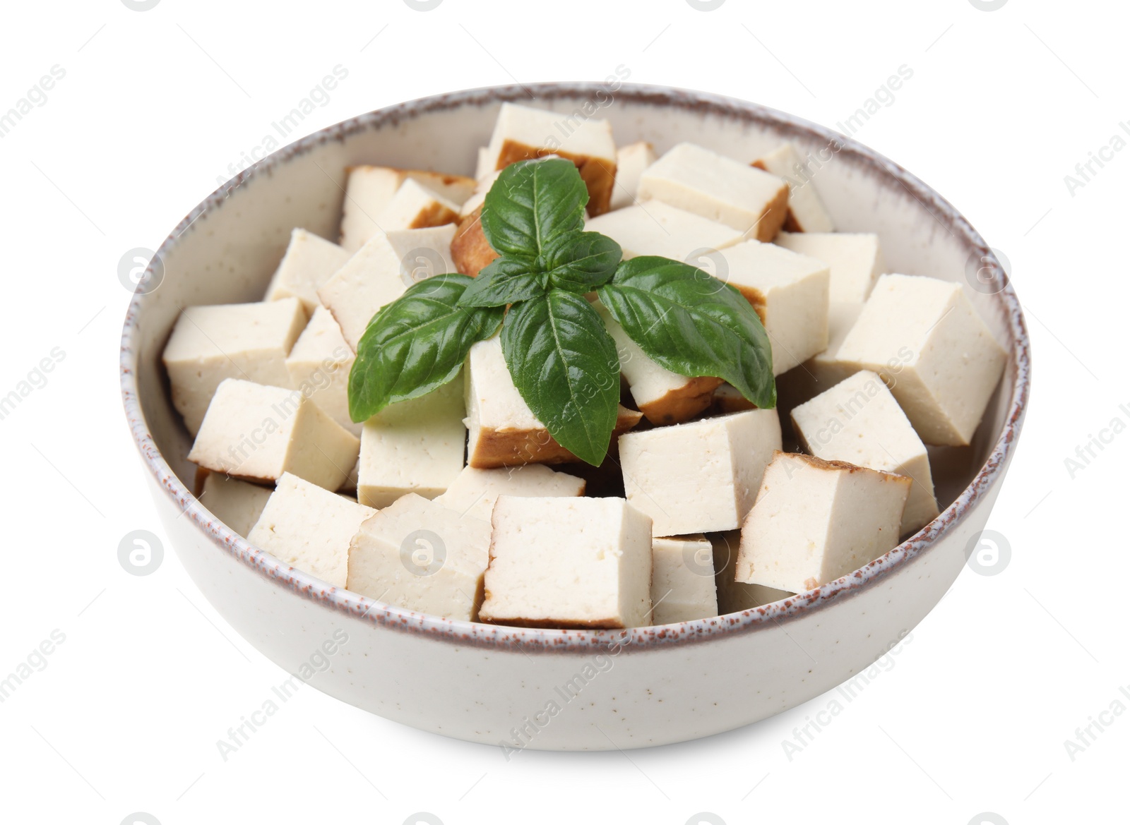 Photo of Bowl with delicious smoked tofu and basil on white background