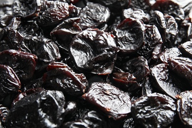 Photo of Tasty prunes as background. Dried fruit as healthy snack