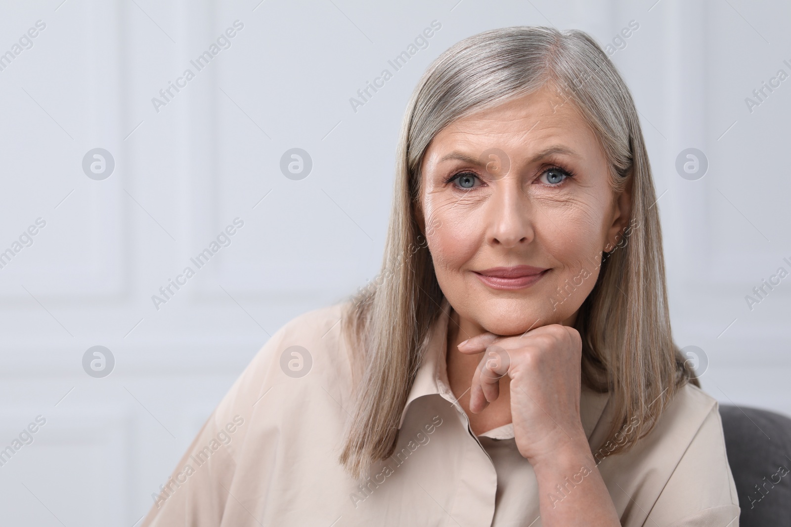 Photo of Portrait of beautiful senior woman indoors. Space for text