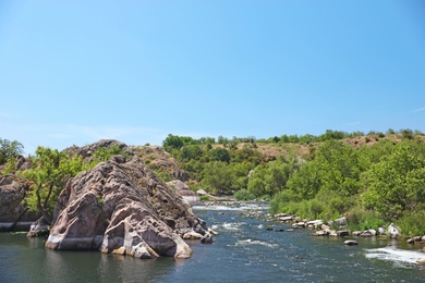 Beautiful landscape with river and rocky hill. Summer camp location