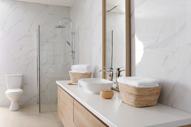 Large mirror and vessel sink in bathroom