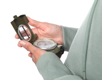 Photo of Woman holding compass on white background, closeup