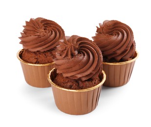 Photo of Three delicious chocolate cupcakes isolated on white