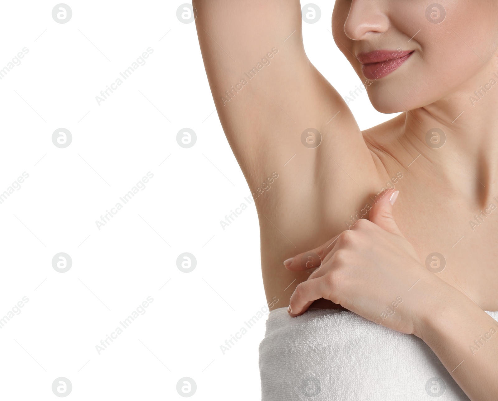 Photo of Young beautiful woman showing armpit with smooth clean skin on white background, closeup