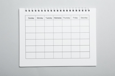 Blank calendar on light grey background, top view
