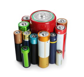 Image of Many batteries of different types on white background
