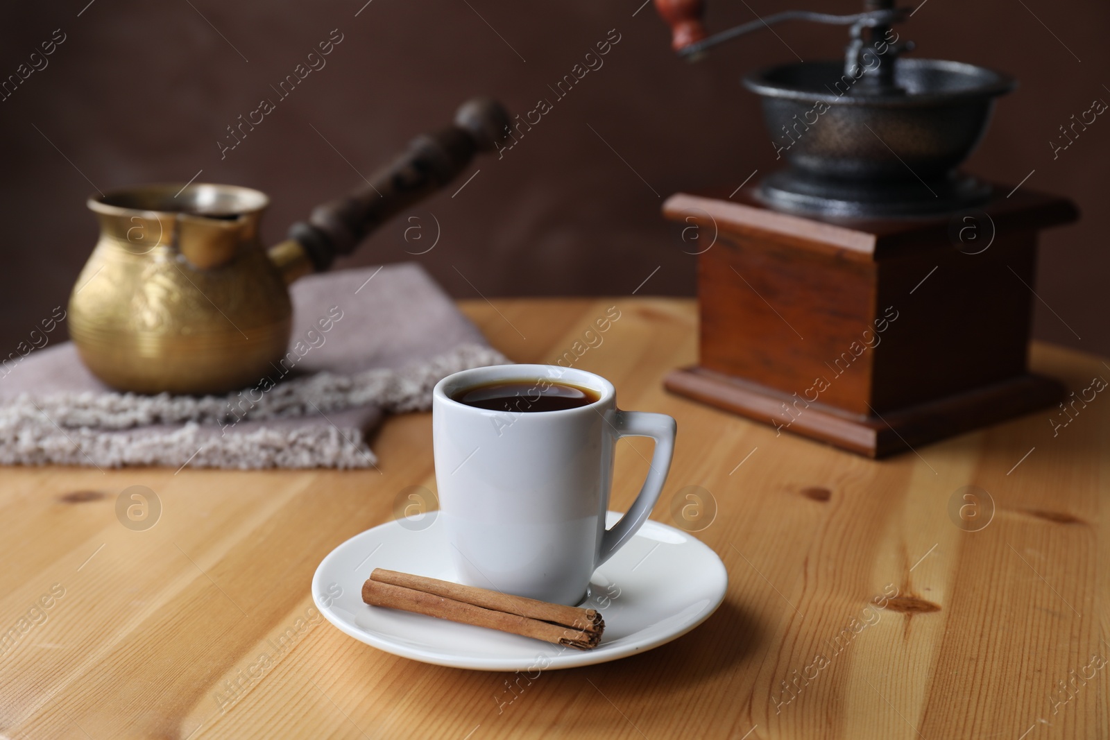 Photo of Turkish coffee. Freshly brewed beverage on wooden table