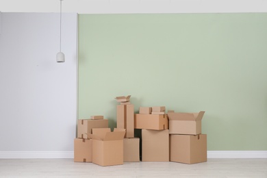 Photo of Cardboard boxes on floor indoors