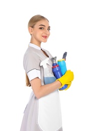 Young chambermaid with detergents on white background