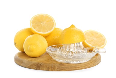 Photo of Plastic juicer and fresh lemons on white background