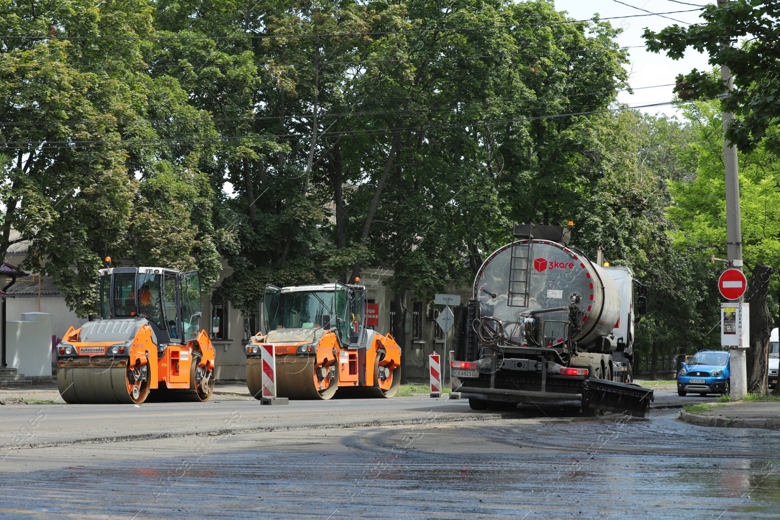 Photo of MYKOLAIV, UKRAINE - AUGUST 04, 2021: Road repair machinery on city street