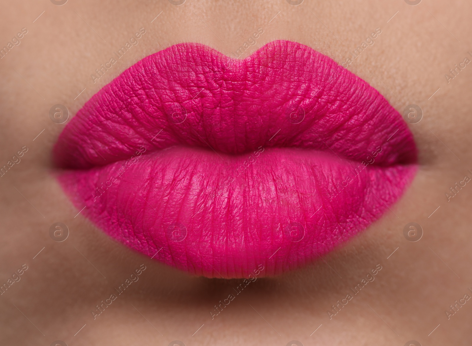 Photo of Closeup view of beautiful woman puckering lips for kiss