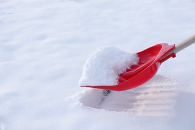 Photo of Shoveling snow outdoors, closeup. Space for text