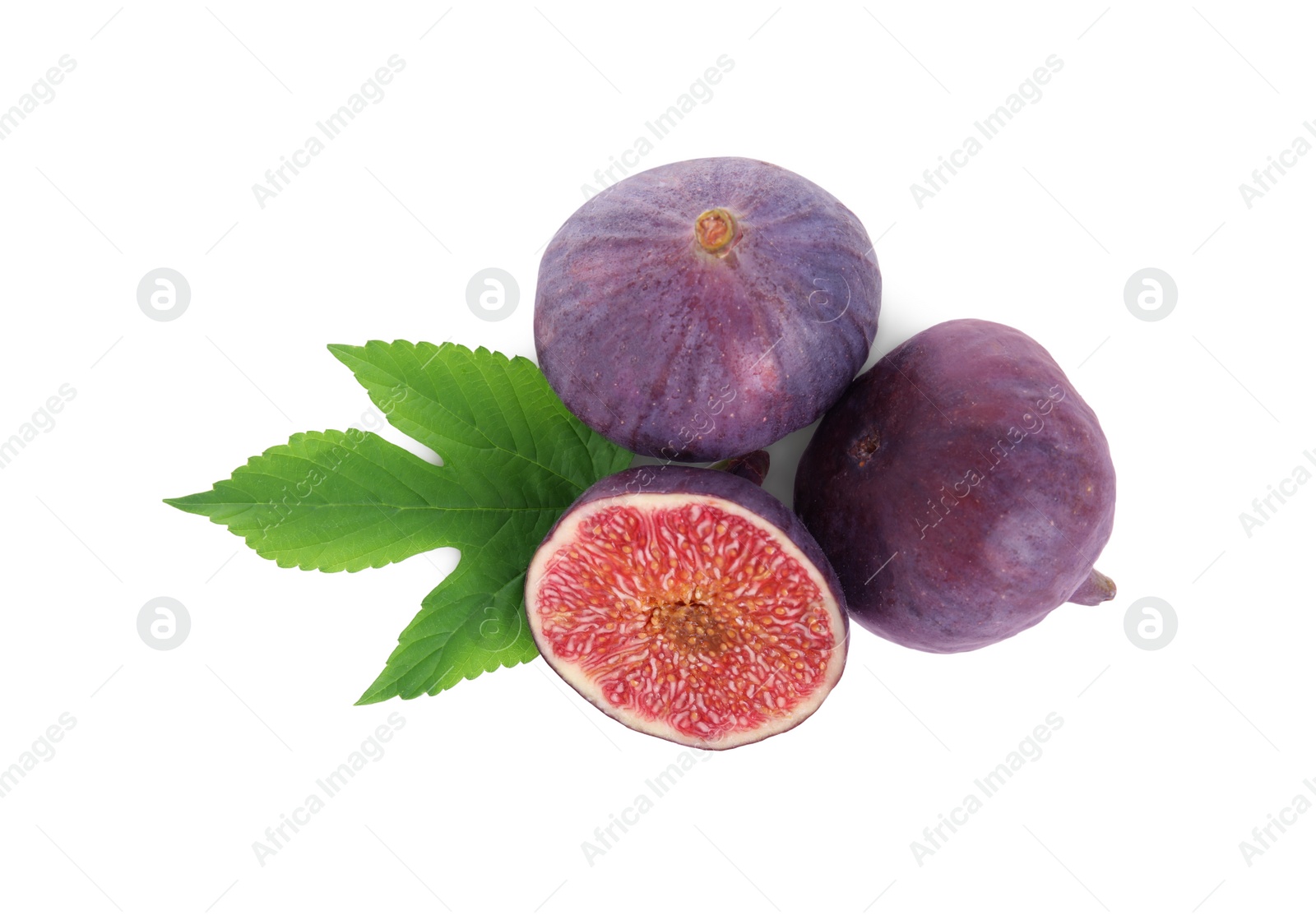 Photo of Whole and cut fresh ripe figs with green leaf isolated on white