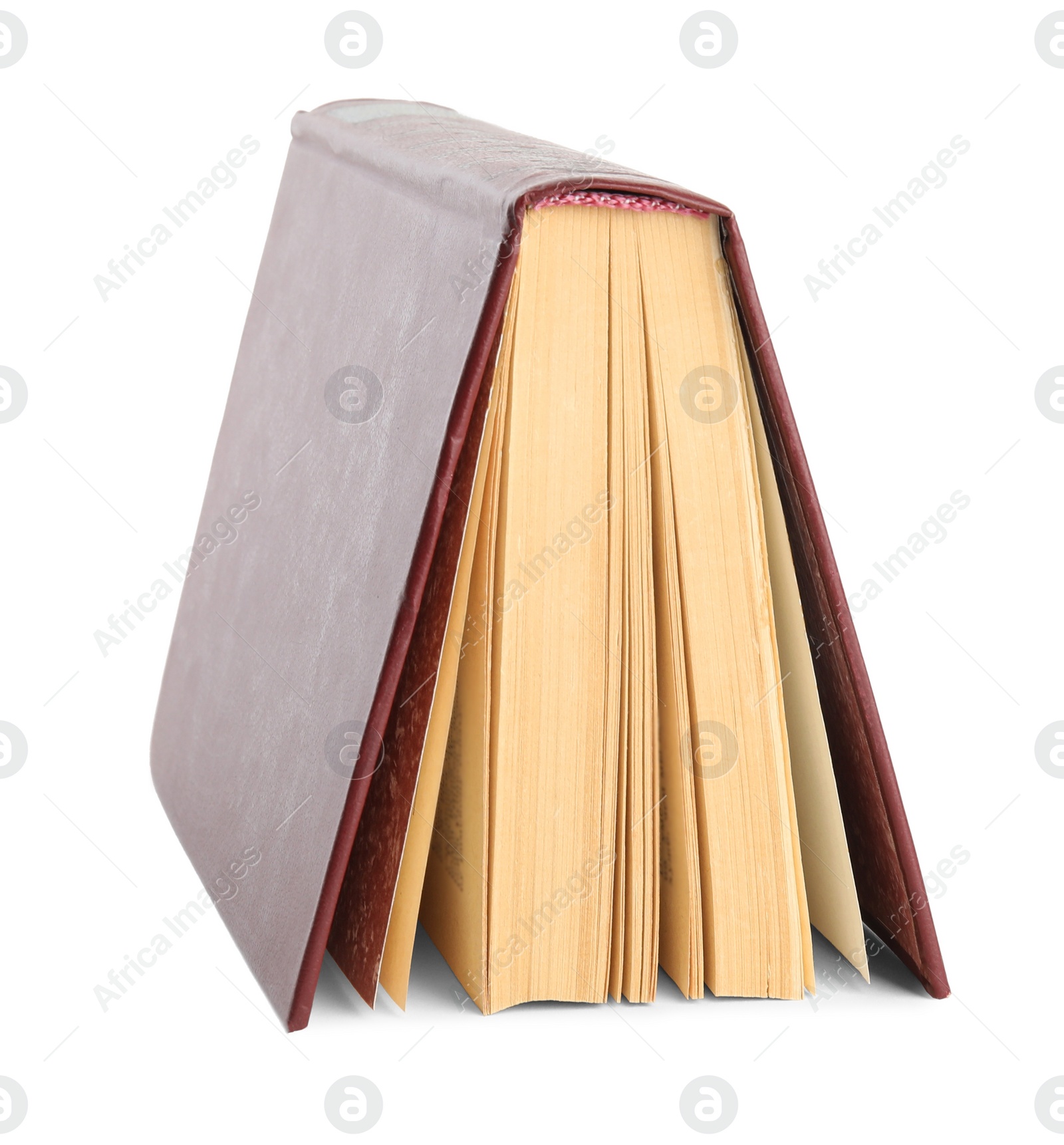 Photo of Open old hardcover book isolated on white