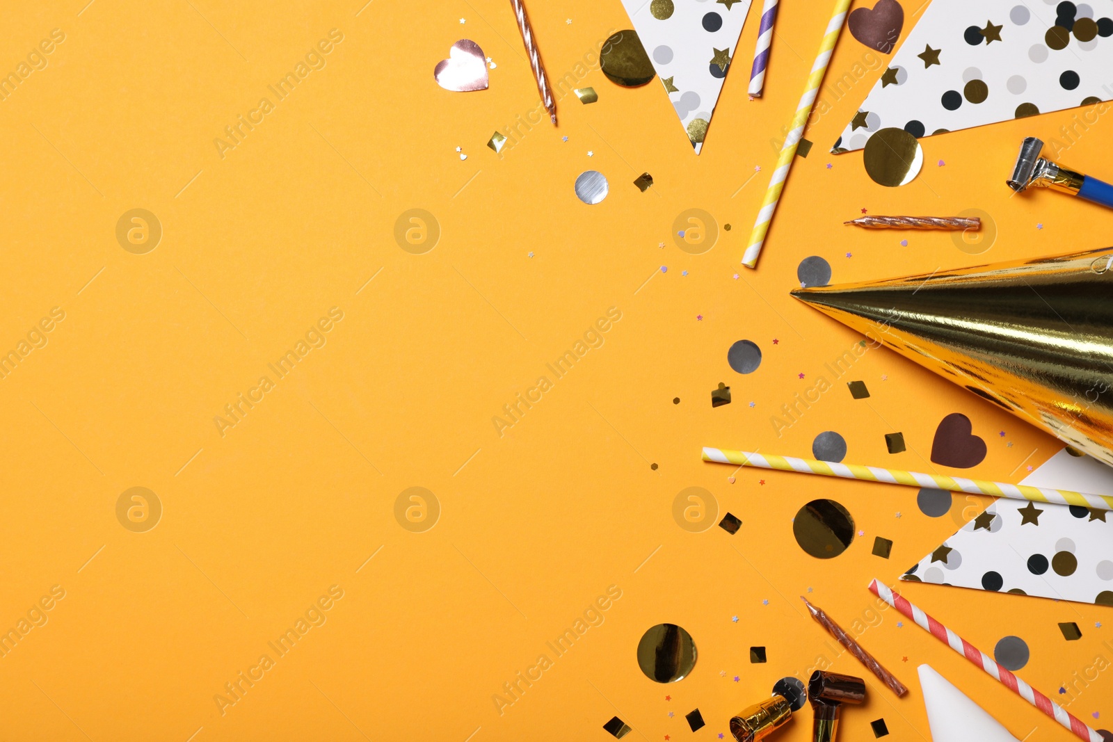 Photo of Flat lay composition with party items on orange background, Space for text