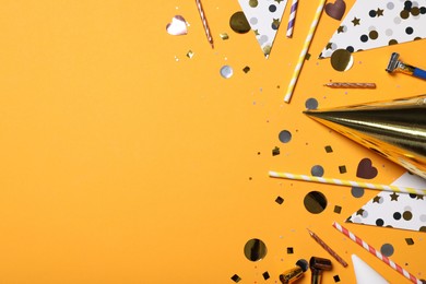 Photo of Flat lay composition with party items on orange background, Space for text