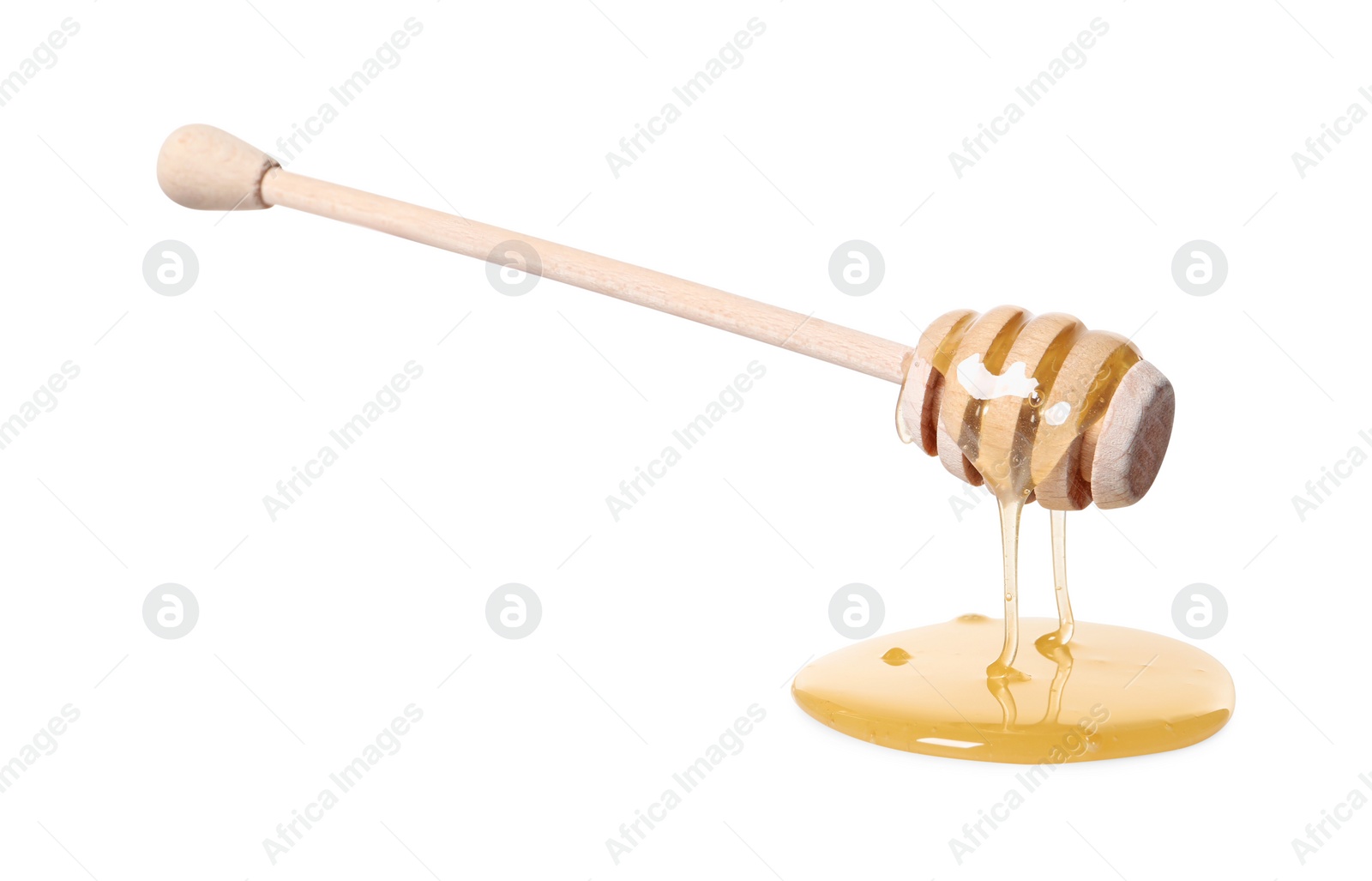 Photo of Natural honey dripping from dipper on white background