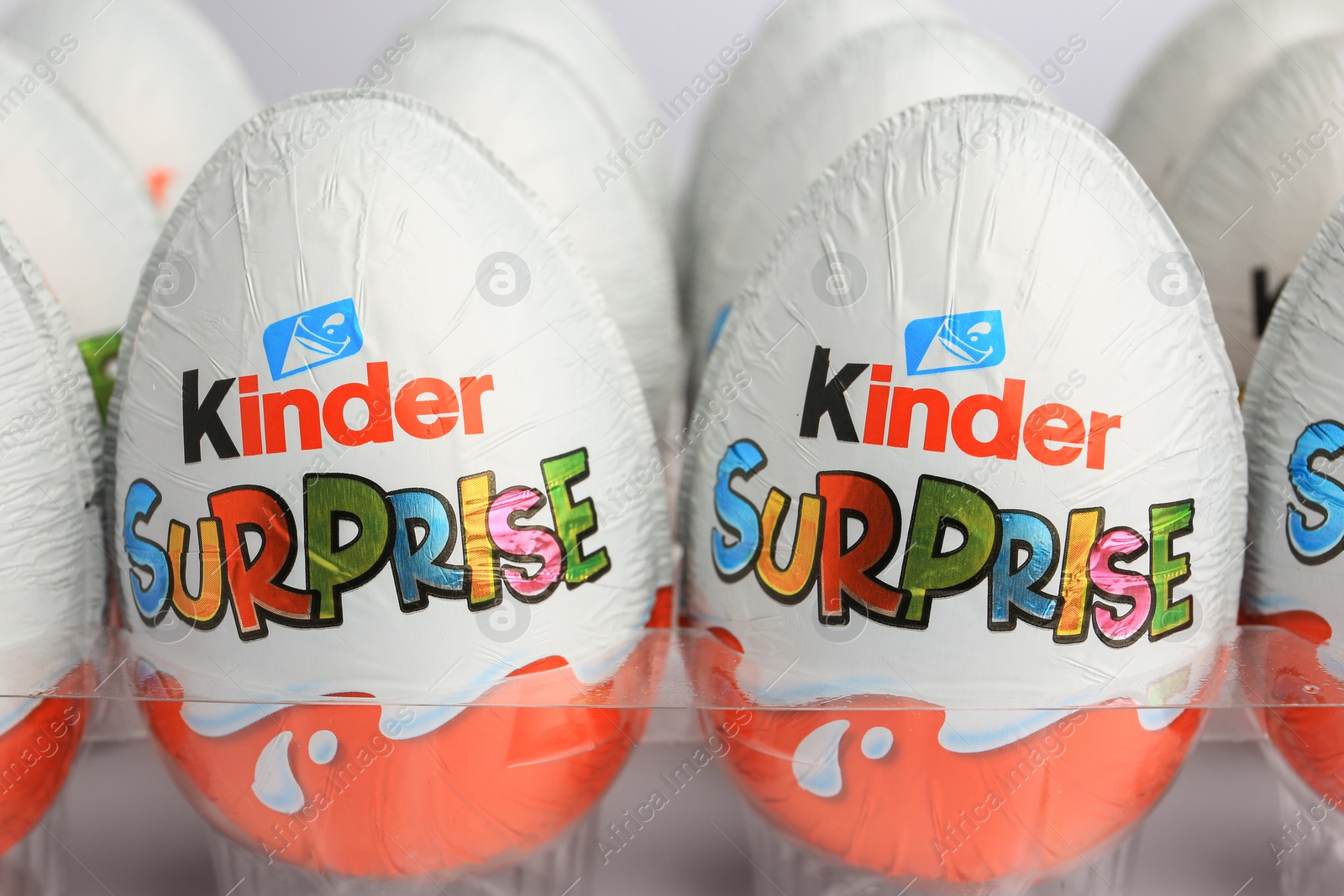 Photo of Sveti Vlas, Bulgaria - June 26, 2023: Kinder Surprise Eggs in plastic tray on white background, closeup