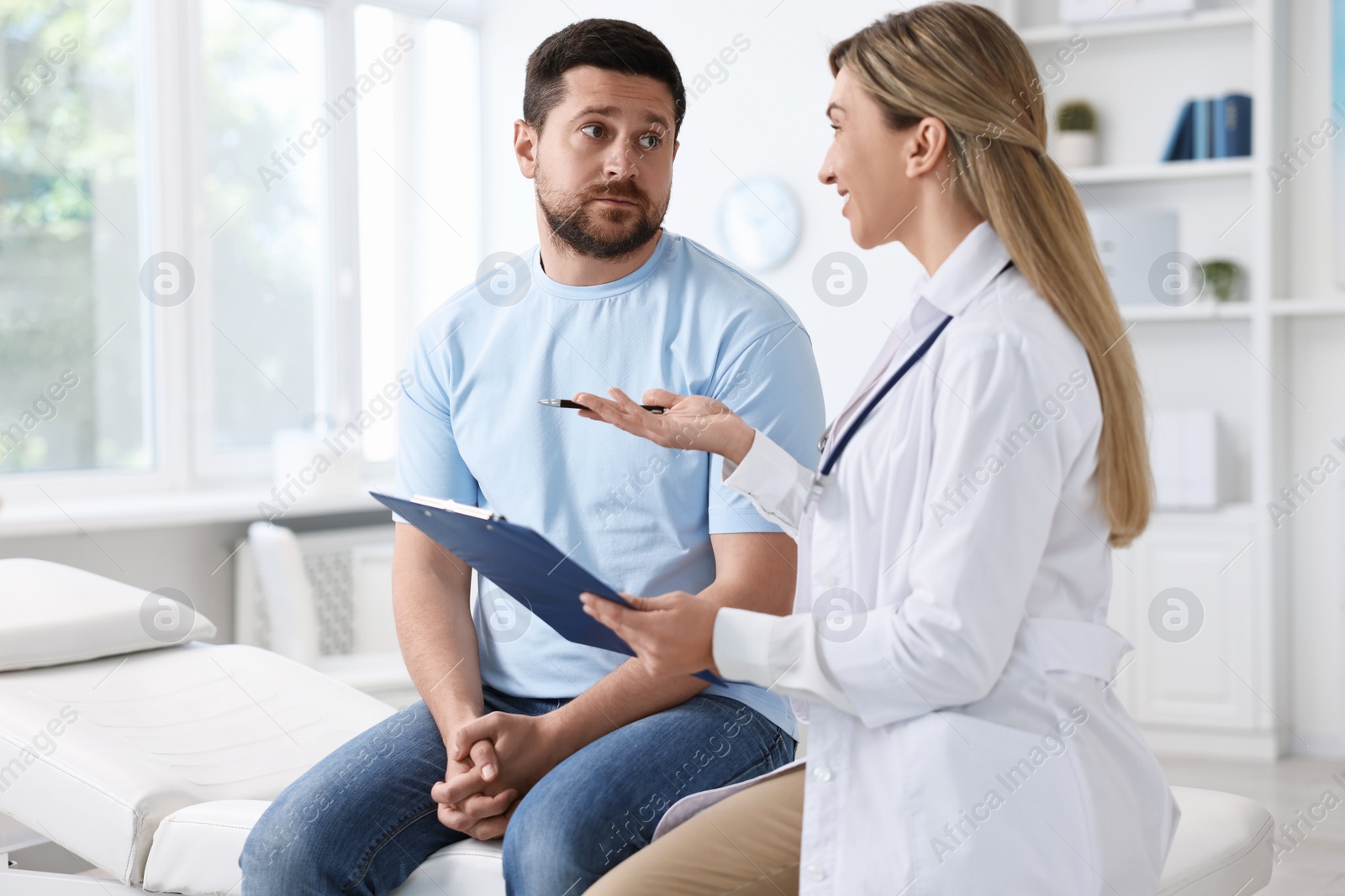 Photo of Professional doctor working with patient in hospital