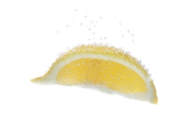 Photo of Slice of lemon in sparkling water on white background. Citrus soda