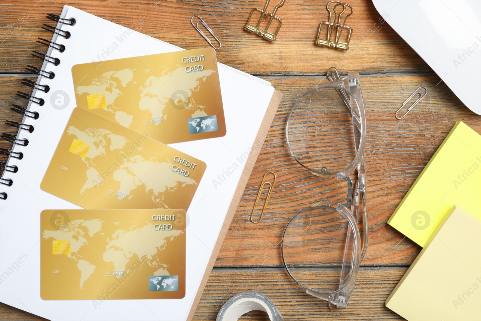 Photo of Flat lay composition with credit cards on wooden background