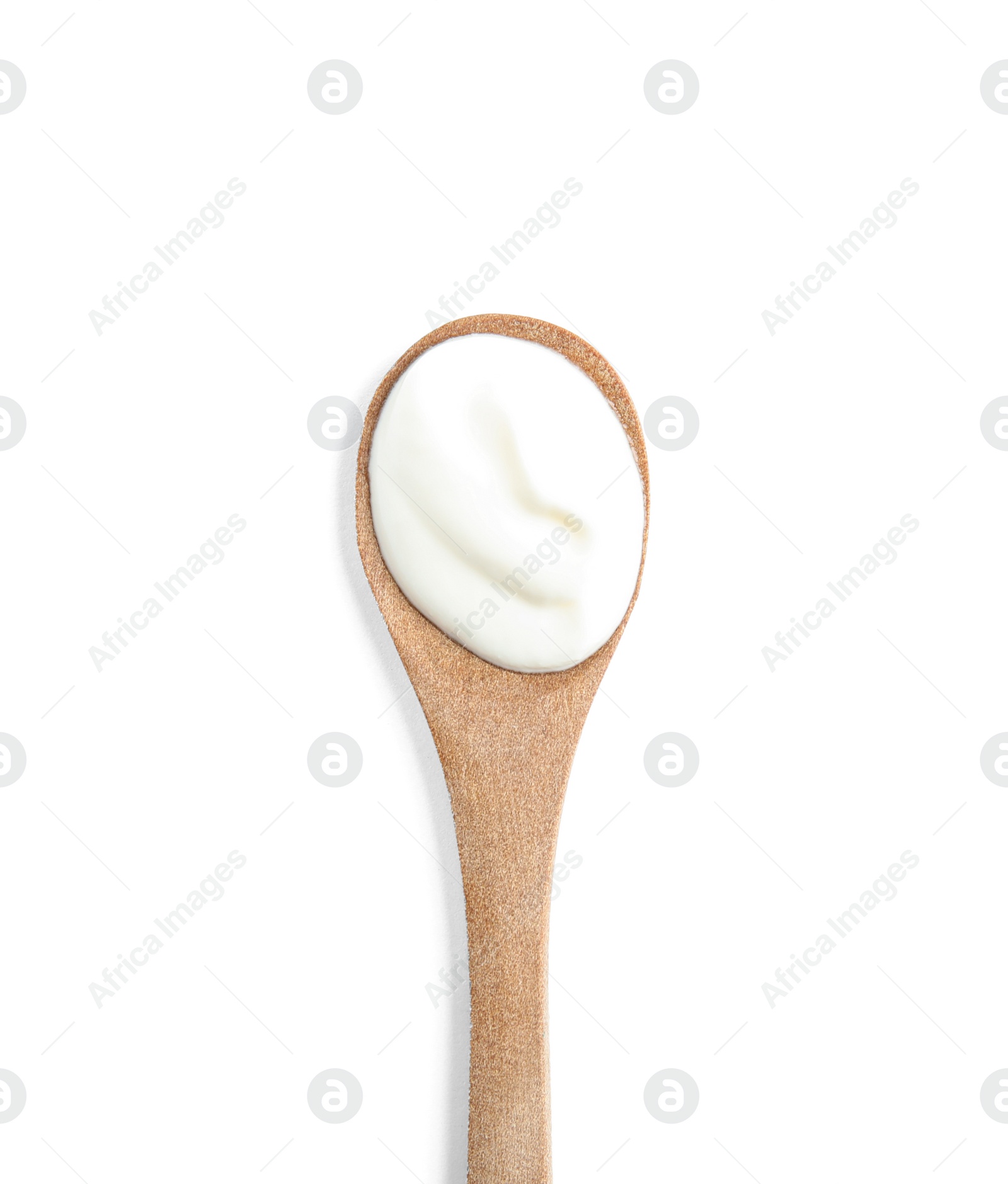 Photo of Wooden spoon with sour cream on white background, top view