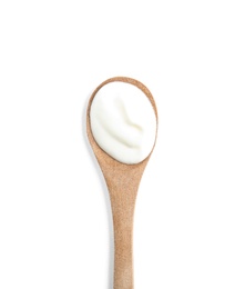 Photo of Wooden spoon with sour cream on white background, top view