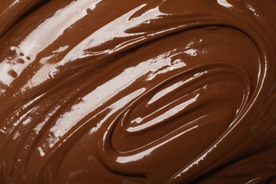 Photo of Tasty milk chocolate paste as background, top view