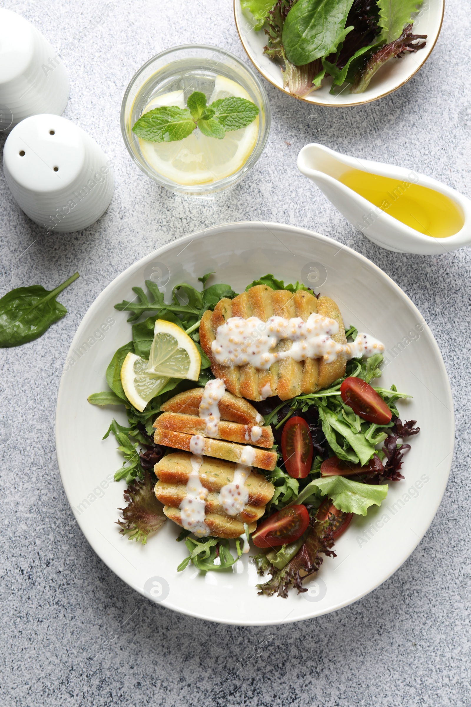 Photo of Healthy dish high in vegetable fats on light textured table, top view